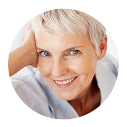 Older woman smiling resting head on hand